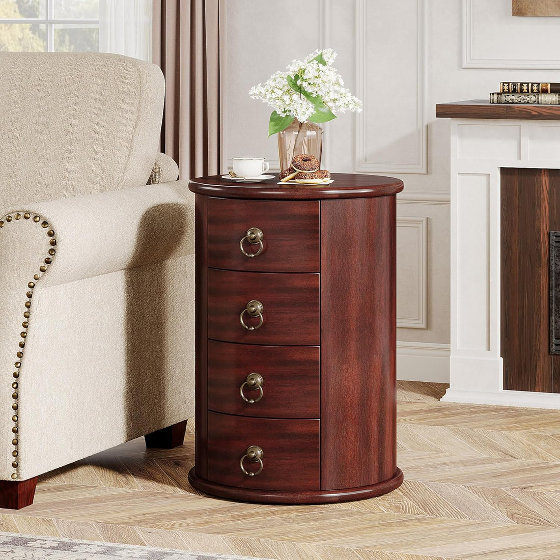 Wooden side table with three drawers in a living room setting.