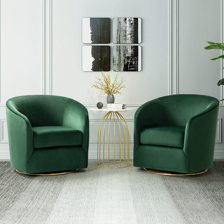 Two green armchairs in a modern living room with abstract art on the wall.