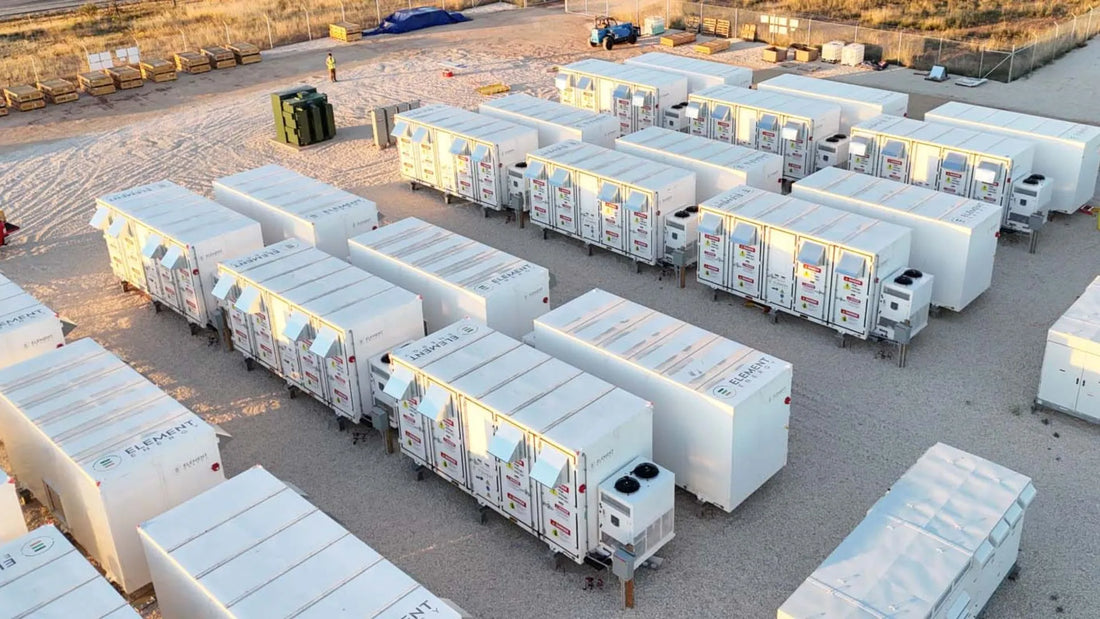 Row of white modular buildings on a concrete surface