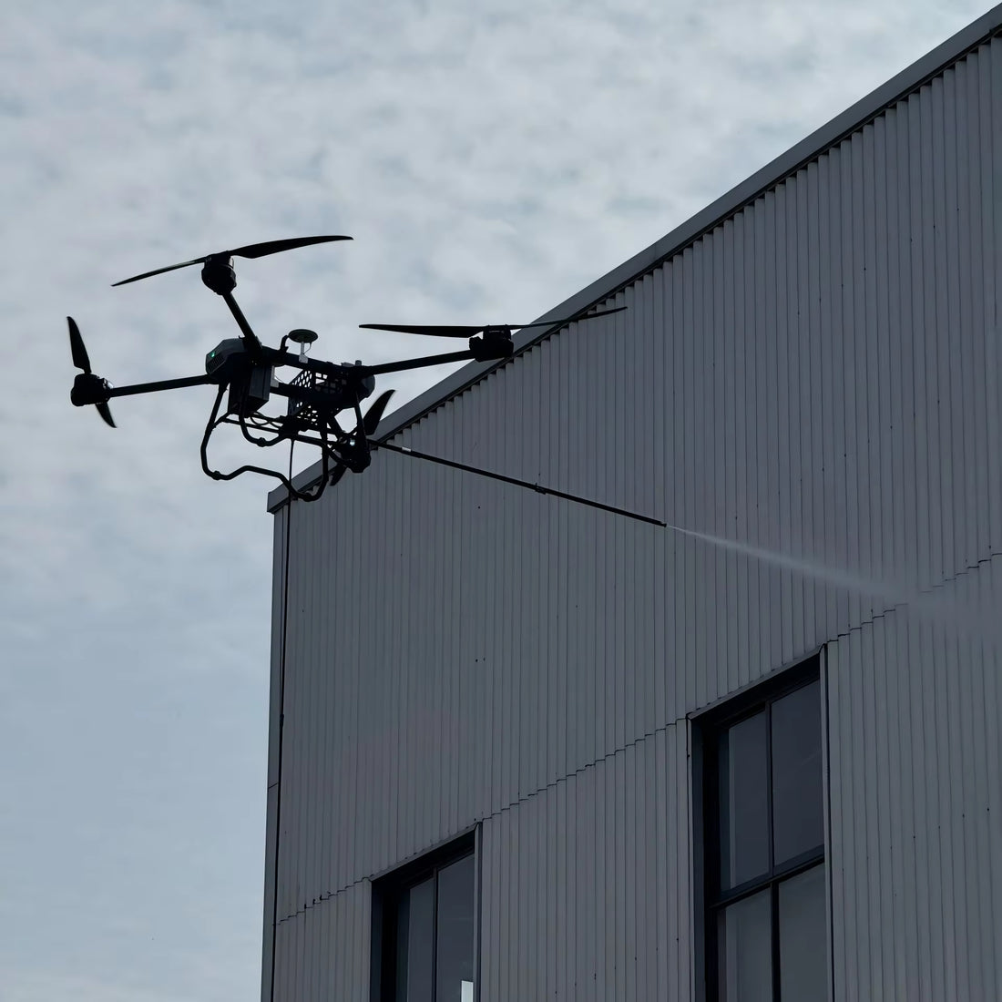 Outdoor Window Cleaning Drone with Water Hose Chemicals
